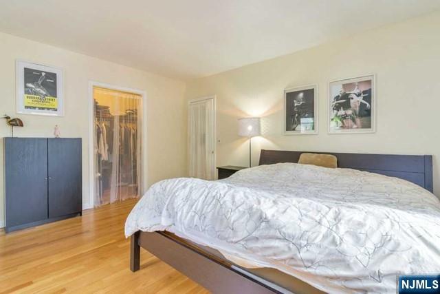 48 Stelfox Street Demarest, NJ 07627 - Photo 10 of 19 a bedroom with a bed and wooden floor