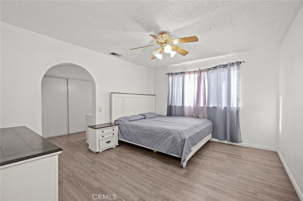 15811 Hercules Street Hesperia, CA 92345 - Photo 17 of 43 a bedroom with a bed and a window