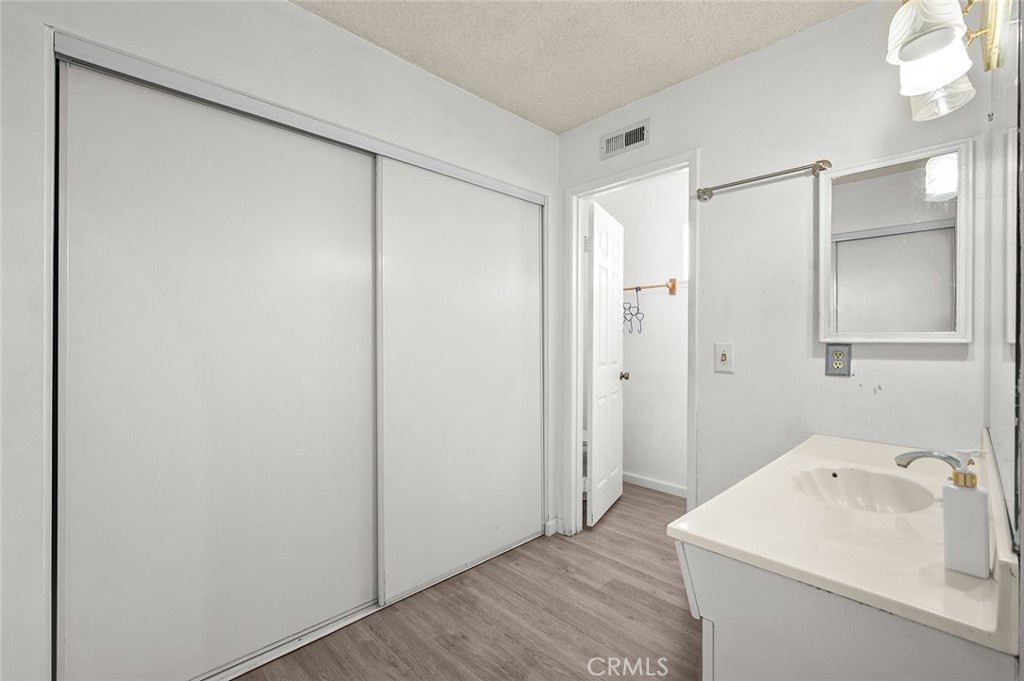 15811 Hercules Street Hesperia, CA 92345 - Photo 19 of 43 a utility room with cabinets washer and dryer