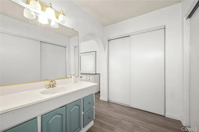 a bathroom with a sink double vanity and a mirror