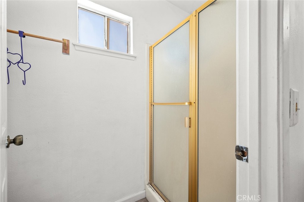 15811 Hercules Street Hesperia, CA 92345 - Photo 21 of 43 a bathroom with a shower