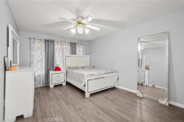 a living room with a bed furniture and a window