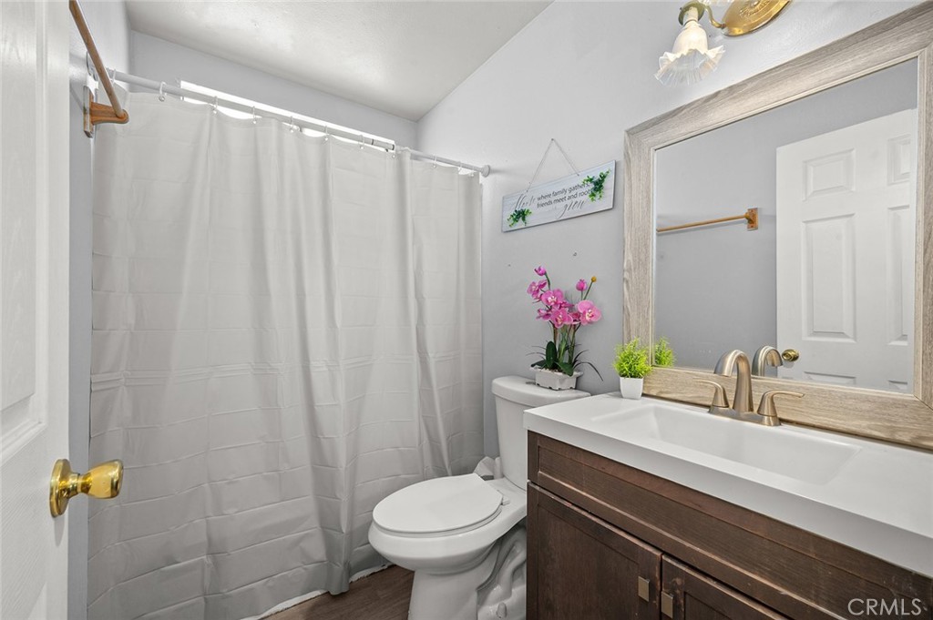 15811 Hercules Street Hesperia, CA 92345 - Photo 24 of 43 a bathroom with a sink toilet and shower