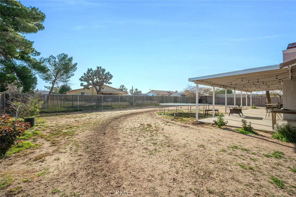15811 Hercules Street Hesperia, CA 92345 - Photo 30 of 43 a view of a yard with an outdoor seating