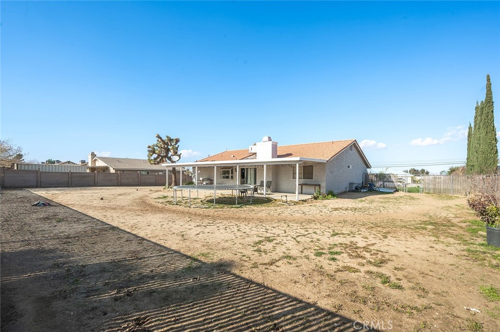 15811 Hercules Street Hesperia, CA 92345 - Photo 31 of 43 a view of a house with a yard