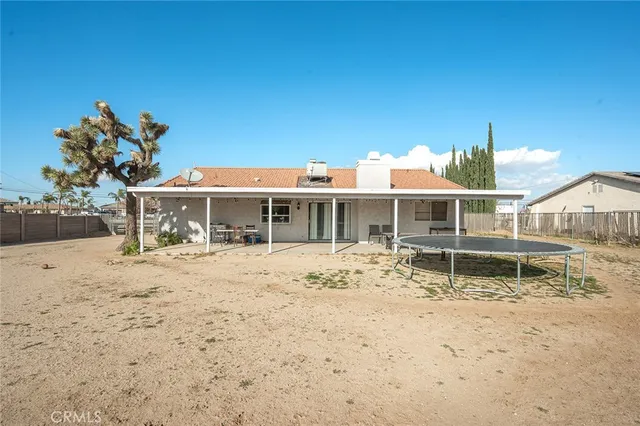 a view of a backyard of a house