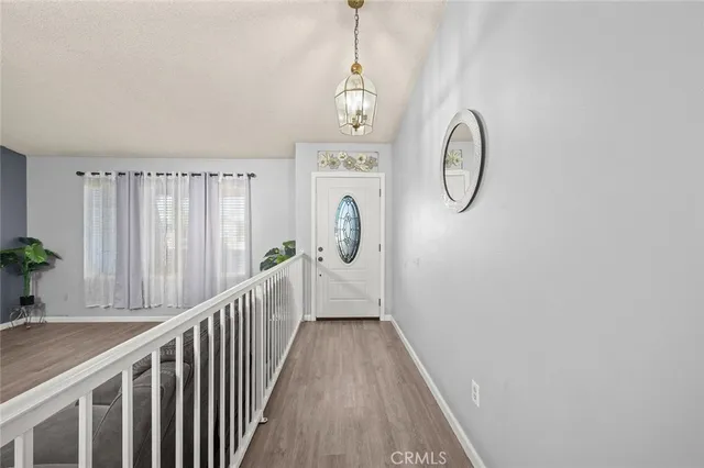 a view of a entryway of wooden floor