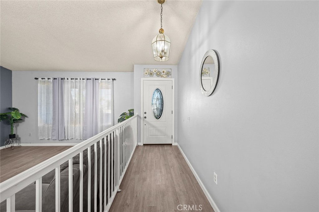 15811 Hercules Street Hesperia, CA 92345 - Photo 9 of 43 a view of a entryway of wooden floor