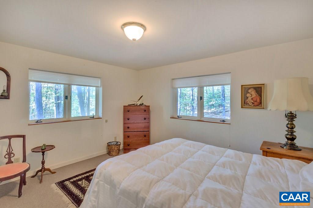 3272 Buck Island Road Charlottesville, VA 22902 - Photo 18 of 41 a bedroom with a bed and a window