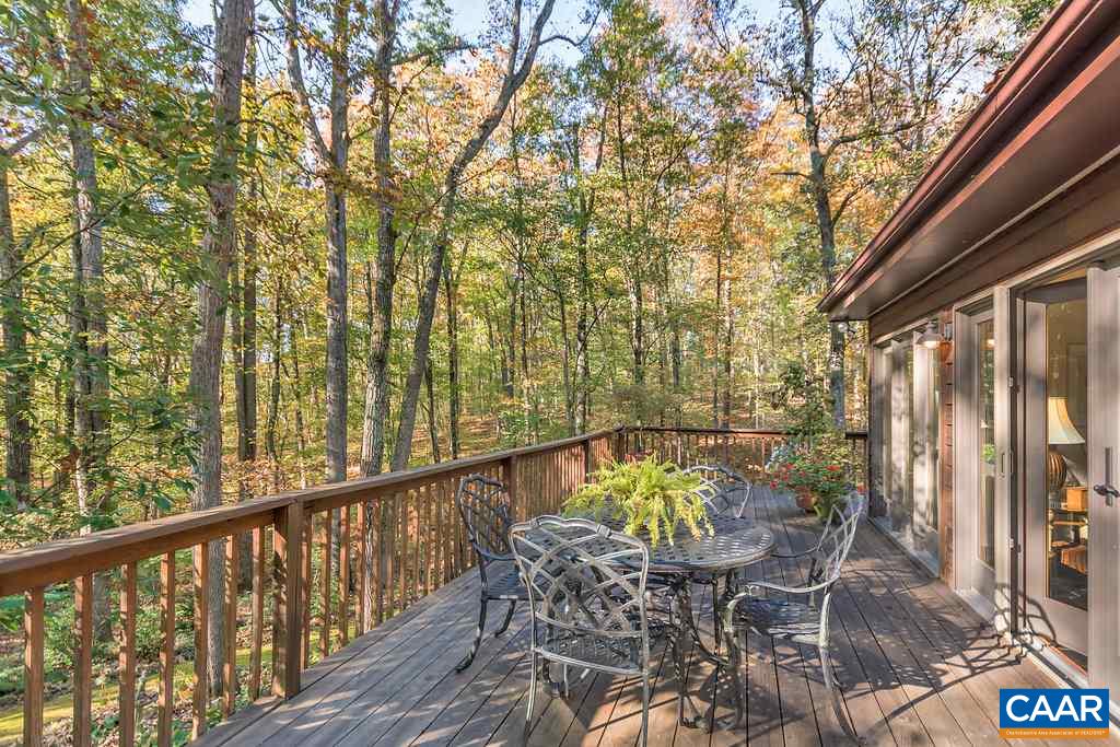 3272 Buck Island Road Charlottesville, VA 22902 - Photo 22 of 41 a view of balcony with furniture and wooden fence