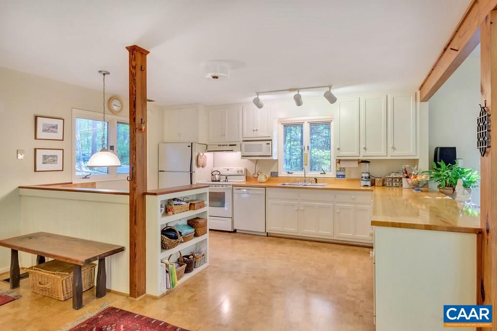 3272 Buck Island Road Charlottesville, VA 22902 - Photo 5 of 41 a kitchen with a refrigerator and a stove top oven