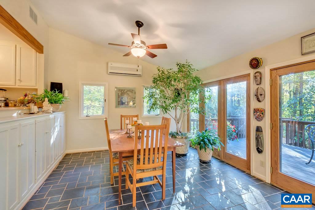 3272 Buck Island Road Charlottesville, VA 22902 - Photo 9 of 41 a view of a dining room with furniture window and wooden floor