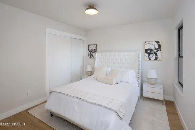 a bedroom with a bed and a lamp