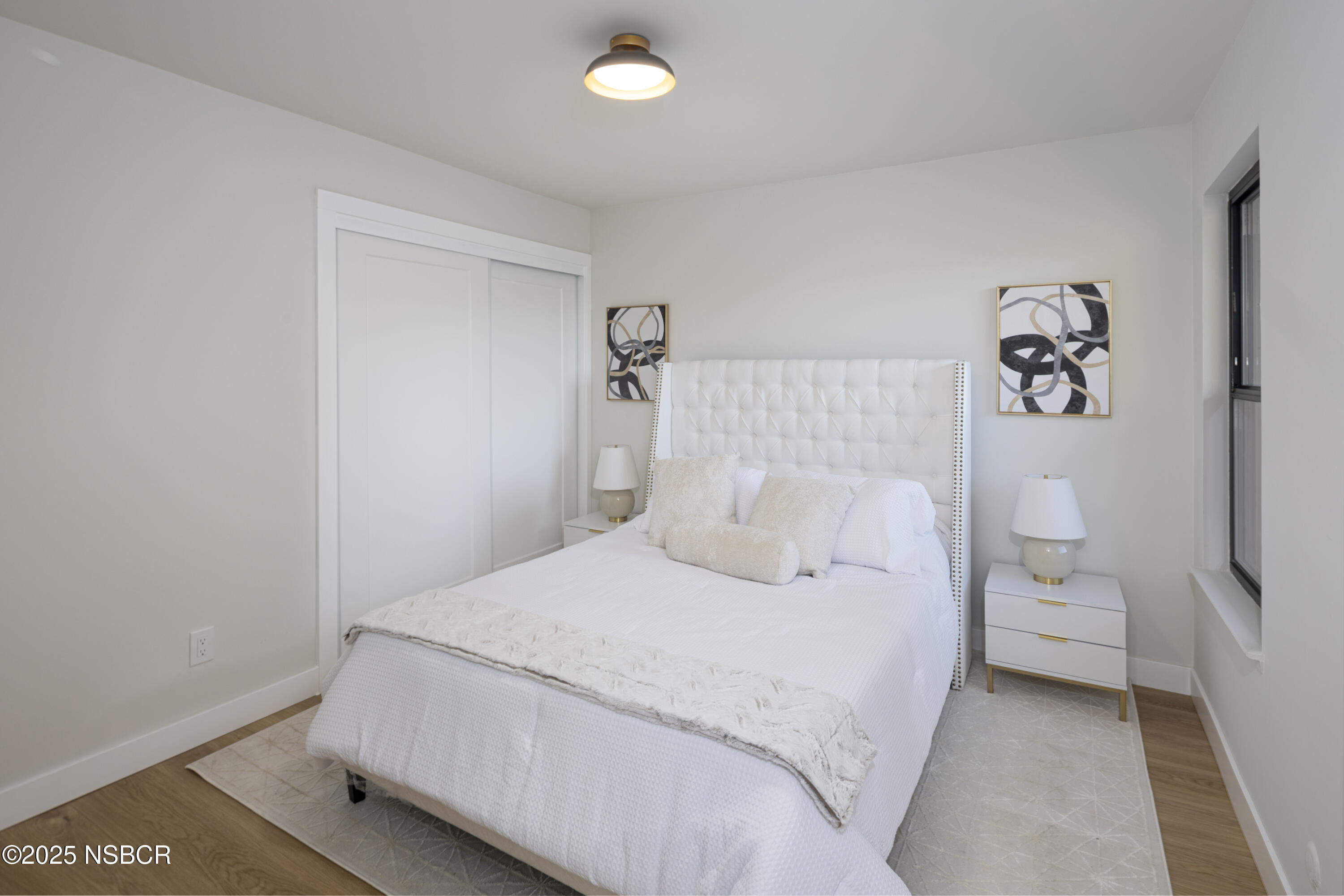 680 Chorro Street, Unit 5 San Luis Obispo, CA 93401 - Photo 14 of 24 a bedroom with a bed and a lamp