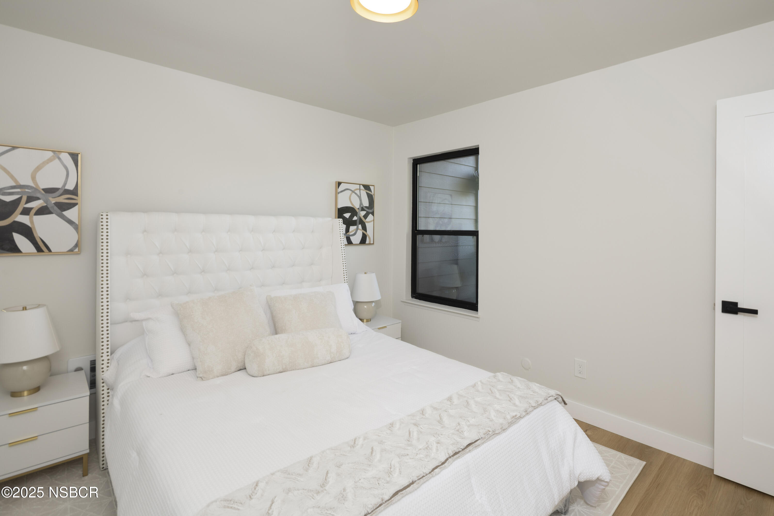 680 Chorro Street, Unit 5 San Luis Obispo, CA 93401 - Photo 15 of 24 a bedroom with a bed and a window