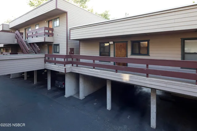a group of people sitting in front of a building