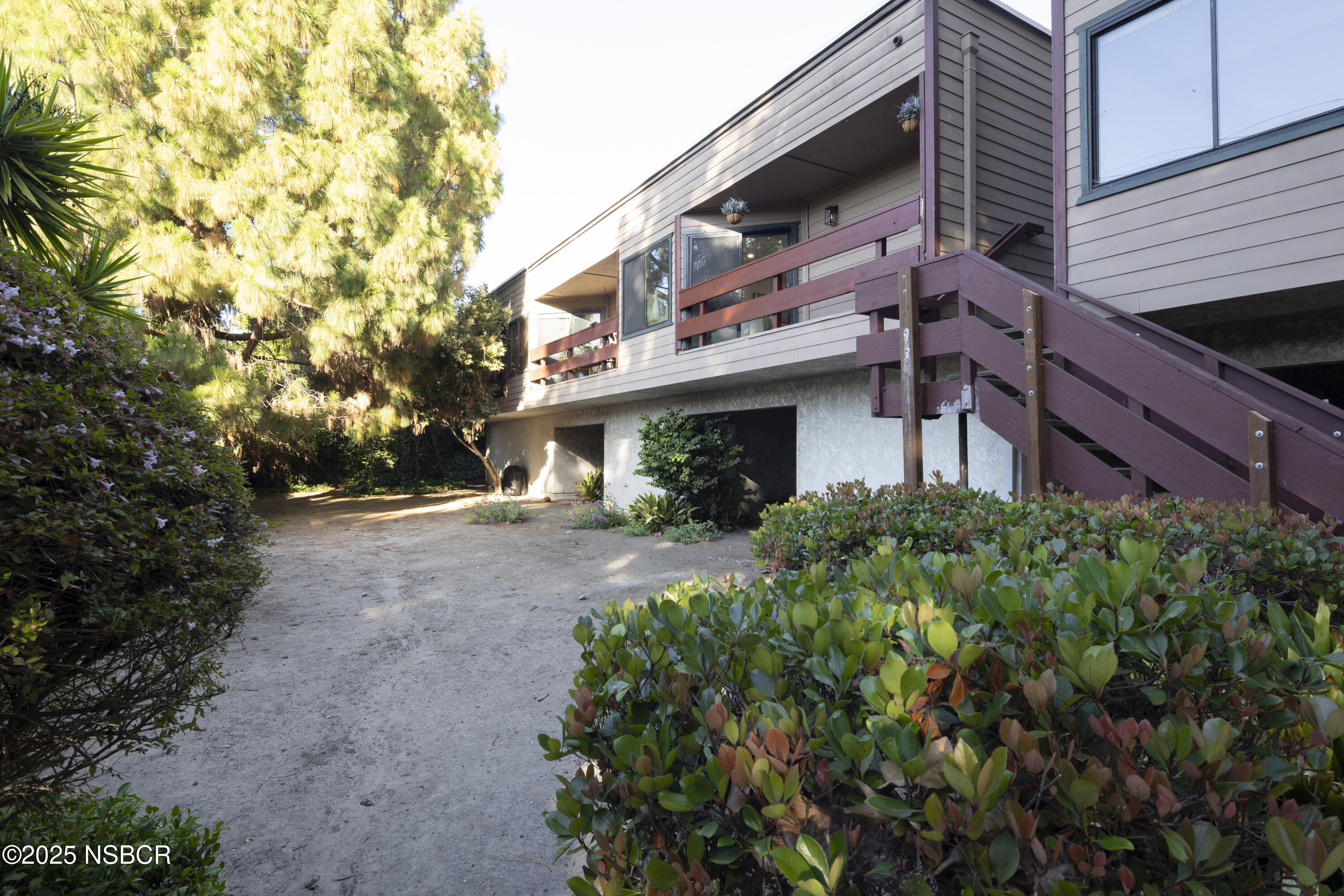 680 Chorro Street, Unit 5 San Luis Obispo, CA 93401 - Photo 21 of 24 a view of a house with a yard and potted plants
