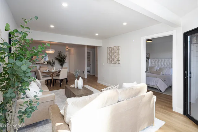 a living room with furniture and a table