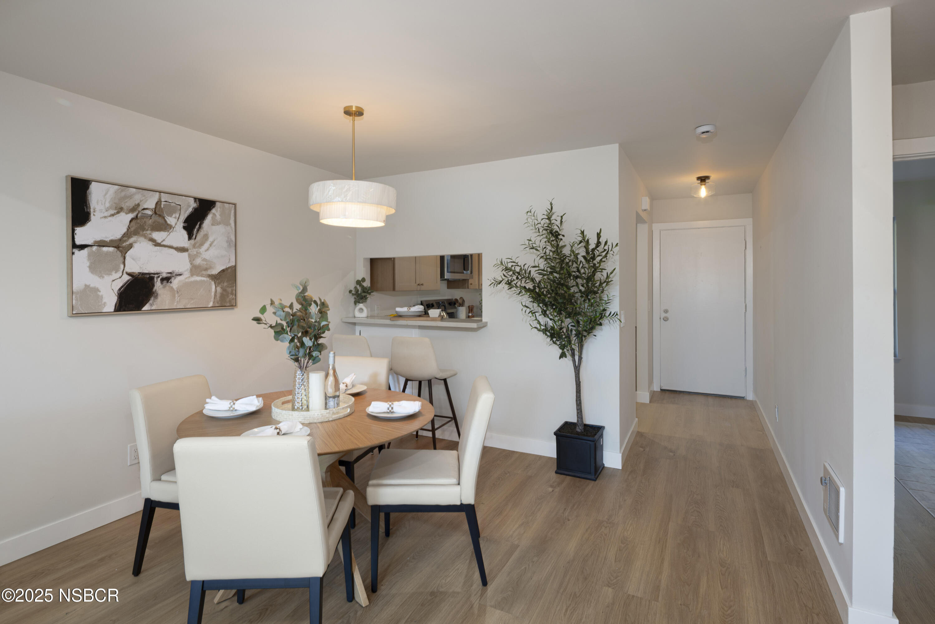 680 Chorro Street, Unit 5 San Luis Obispo, CA 93401 - Photo 5 of 24 a view of a livingroom with furniture and a potted plant