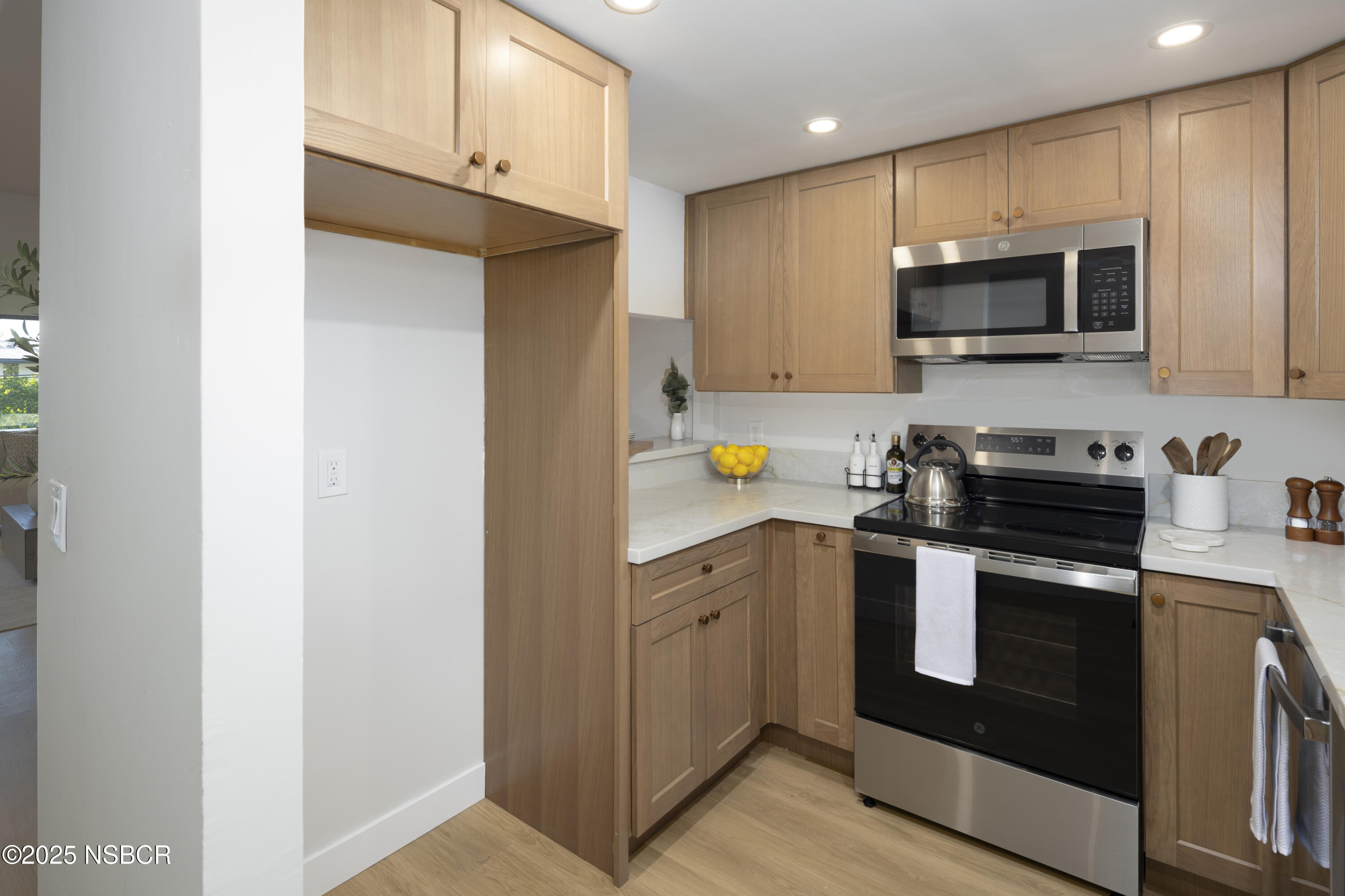 680 Chorro Street, Unit 5 San Luis Obispo, CA 93401 - Photo 7 of 24 a kitchen with stainless steel appliances a stove microwave and sink