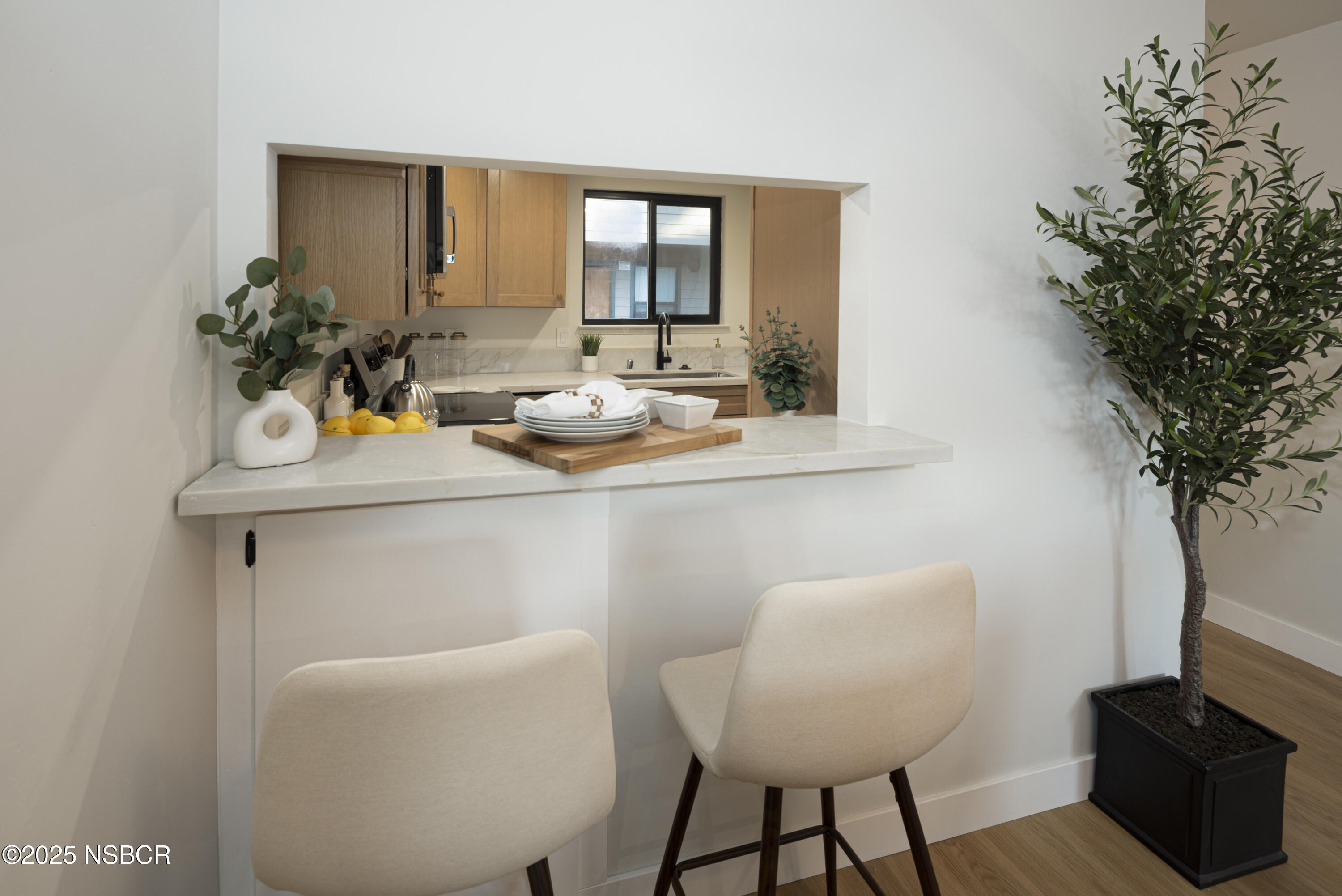 680 Chorro Street, Unit 5 San Luis Obispo, CA 93401 - Photo 8 of 24 a room with a table chairs and a potted plant