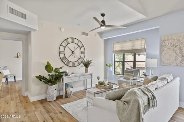 a view of a dining room with furniture wooden floor and chandelier