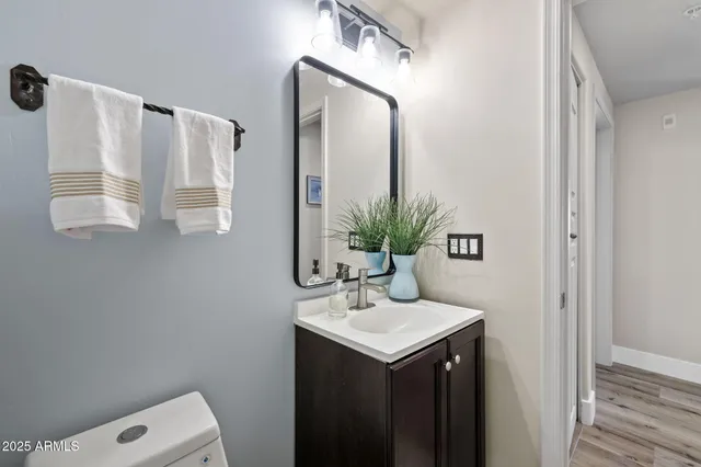 a kitchen with granite countertop a sink and a wooden cabinets