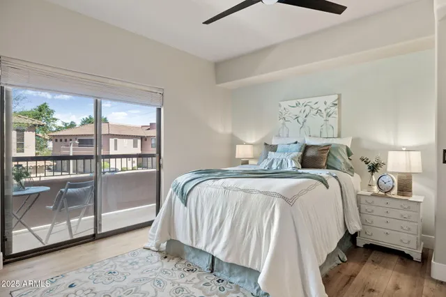 a en suite bathroom with a toilet a sink and a mirror