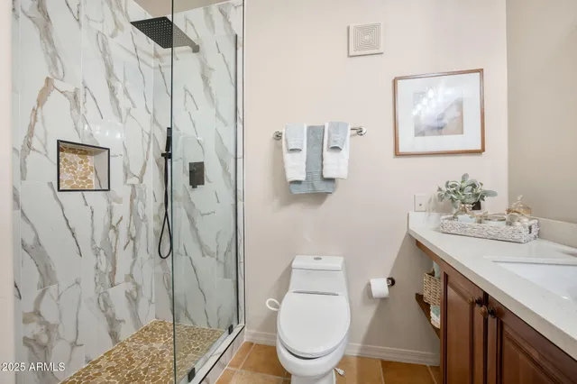 a bedroom with a bed and a chair