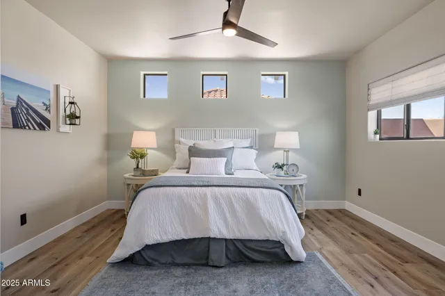 a spacious bathroom with a sink a toilet and a shower