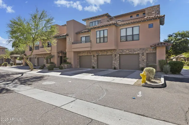 a view of a patio with table and chairs and potted plants