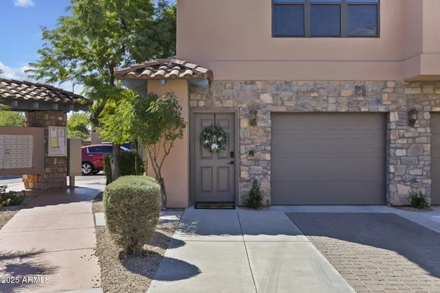 a front view of a house with a garage