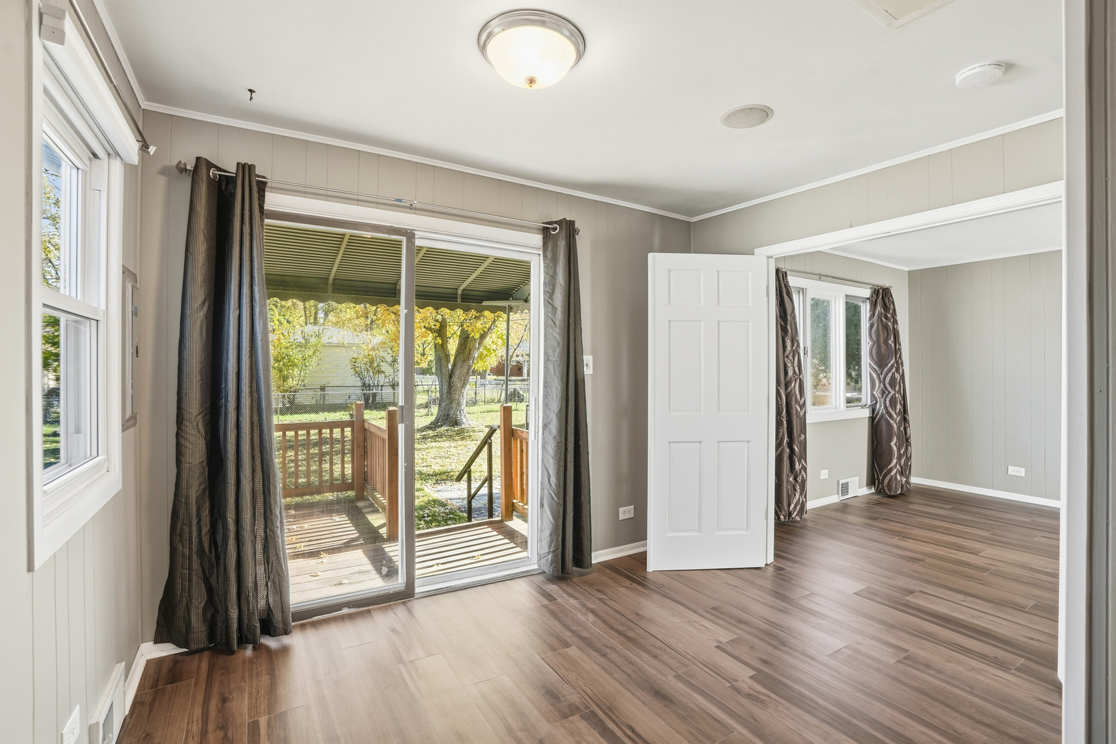3439 Sangamon Street Steger, IL 60475 - Photo 12 of 25 a view of an empty room with wooden floor and a window