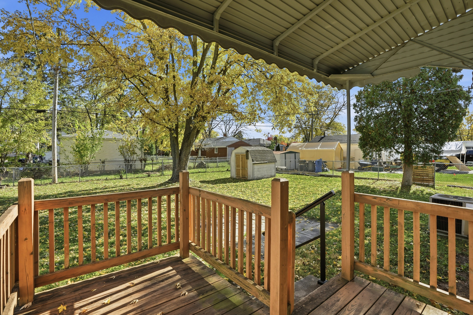3439 Sangamon Street Steger, IL 60475 - Photo 21 of 25 a view of a street with wooden fence