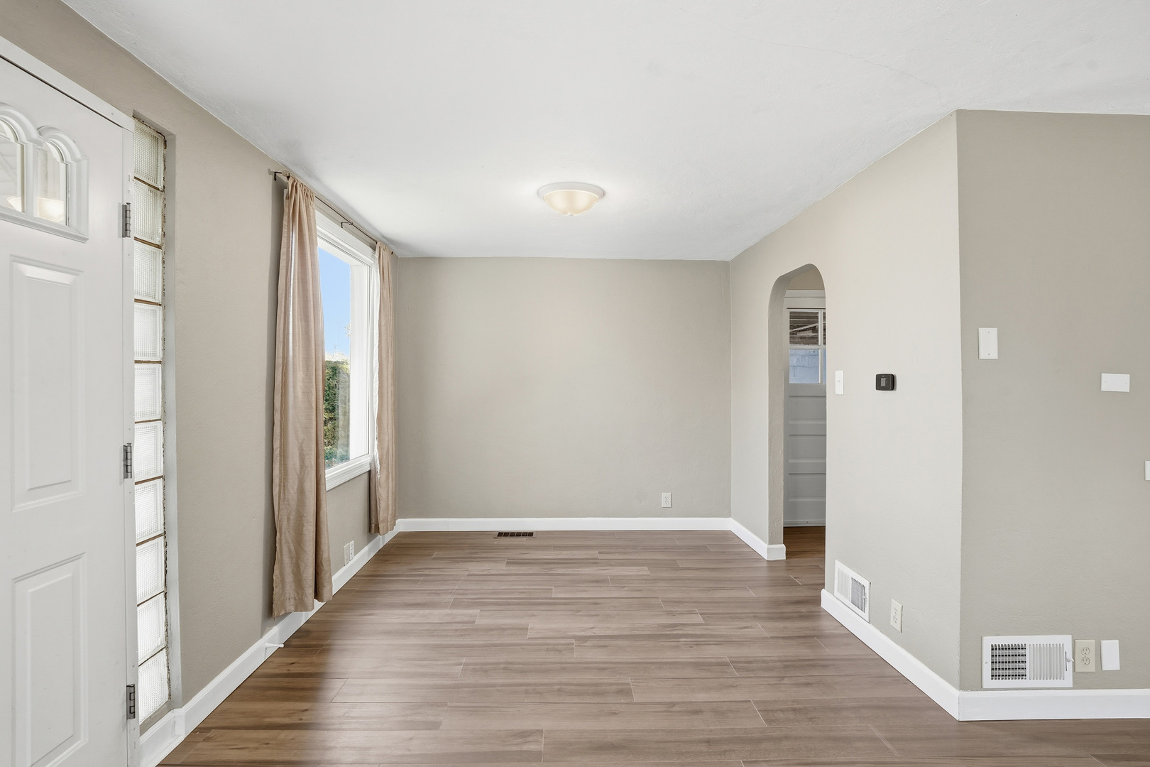 3439 Sangamon Street Steger, IL 60475 - Photo 7 of 25 a view of an empty room with wooden floor