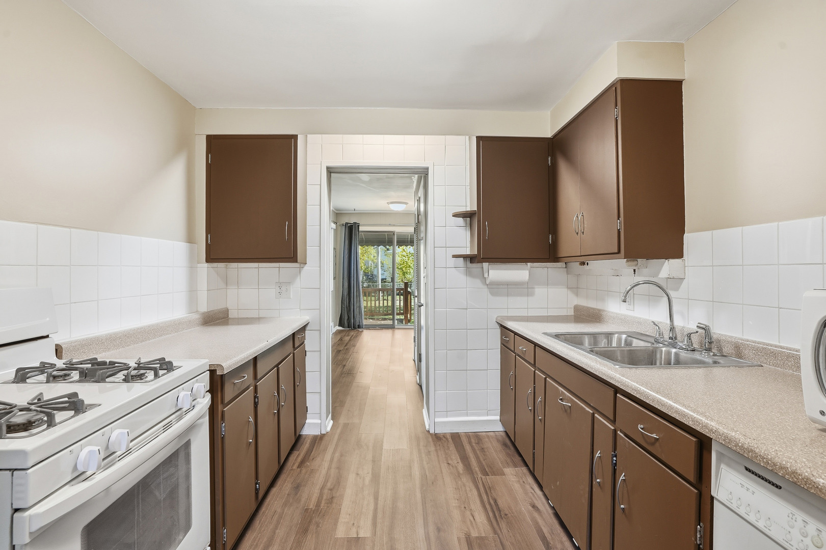 3439 Sangamon Street Steger, IL 60475 - Photo 8 of 25 a kitchen with a sink stove and cabinets