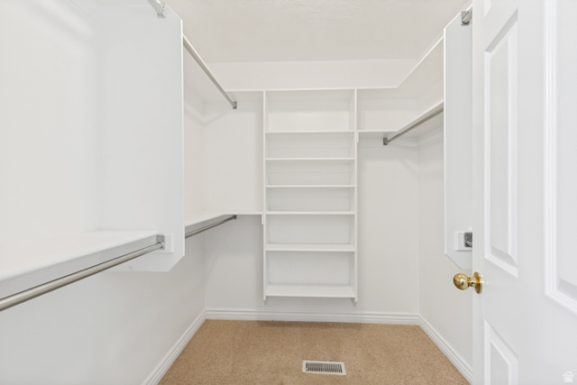 298 North Canyon Road Bountiful, UT 84010 - Photo 31 of 57 Custom-built closet system featuring white shelving and chrome hanging rods