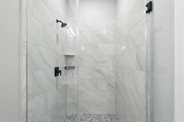 a front view of the house with a yard and garage