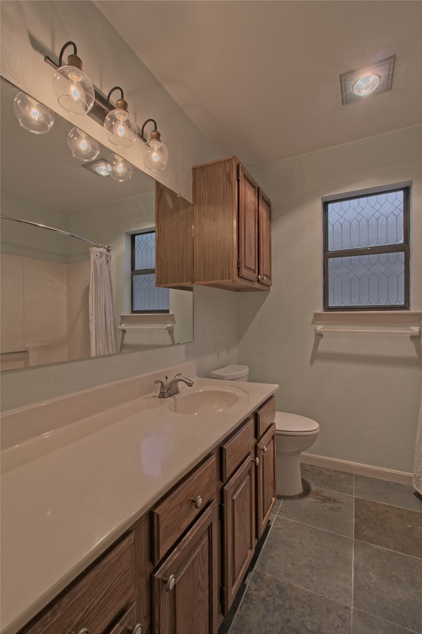 1102 Fowzer Street Taylor, TX 76574 - Photo 20 of 27 Full bath with vanity and a shower with curtain