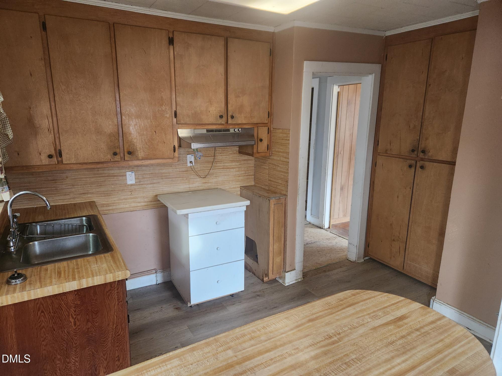 83 Wimberly Road Moncure, NC 27559 - Photo 11 of 17 a kitchen with a sink and a refrigerator