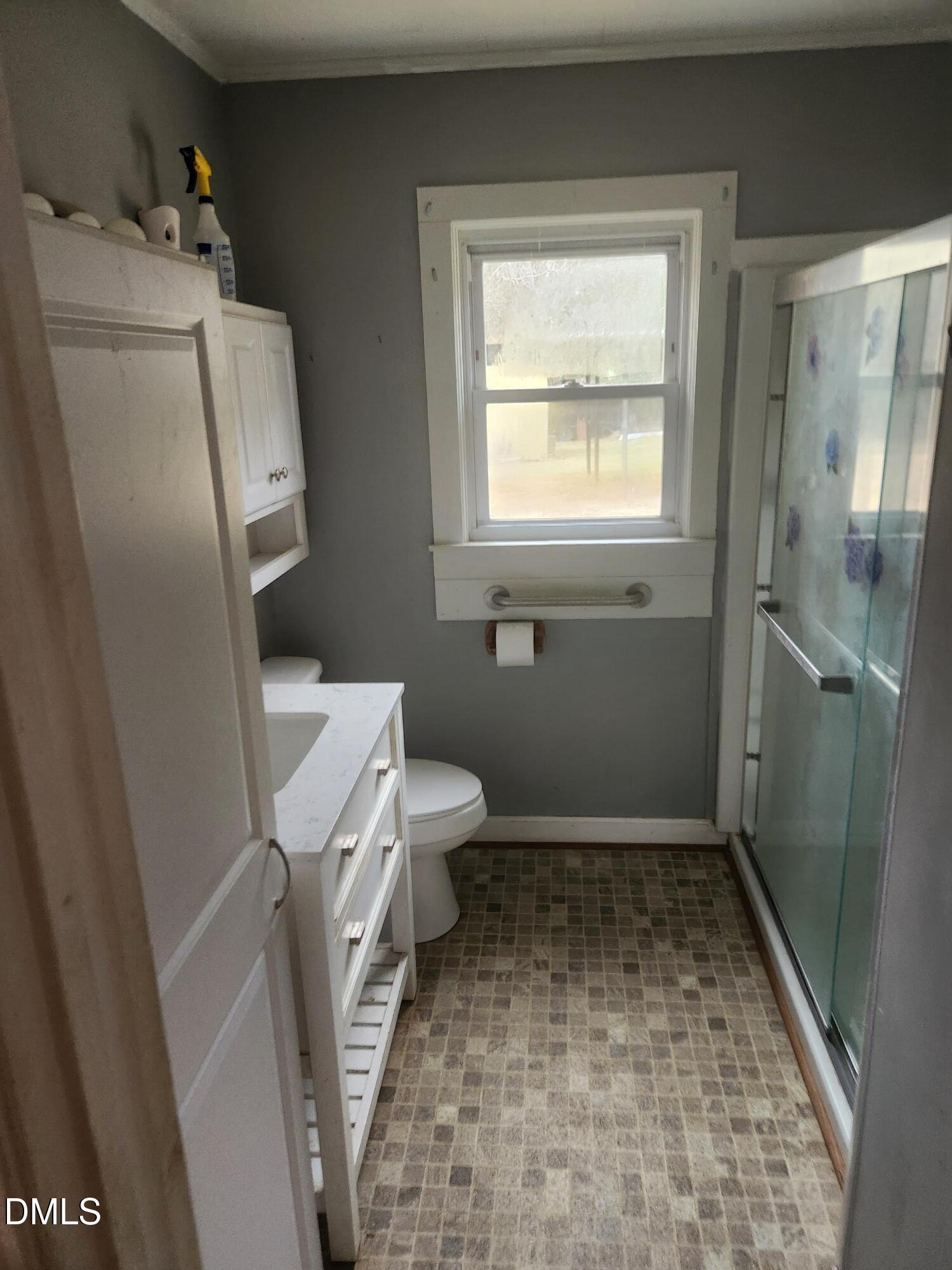 83 Wimberly Road Moncure, NC 27559 - Photo 13 of 17 a bathroom with a toilet and a shower