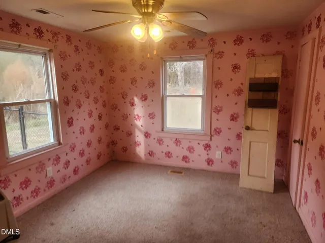 en empty room with windows