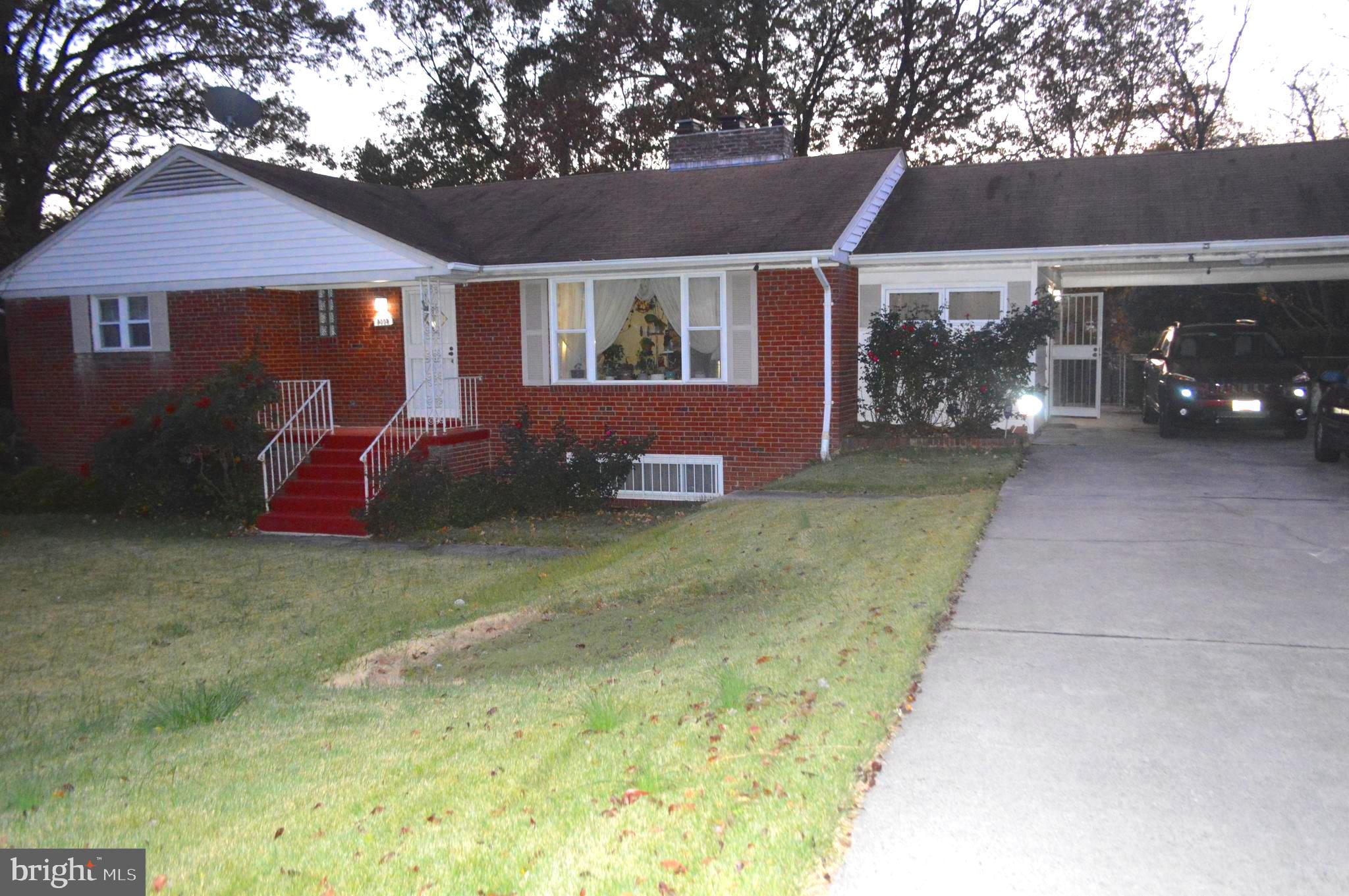 Front View with large 2 car carport