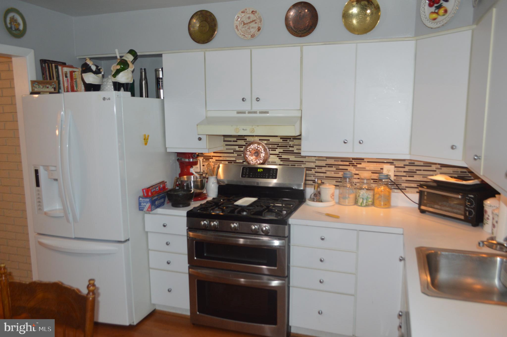 5009 Hagan Road Temple Hills, MD 20748 - Photo 15 of 33 Kitchen with Large Modern Refrigerator