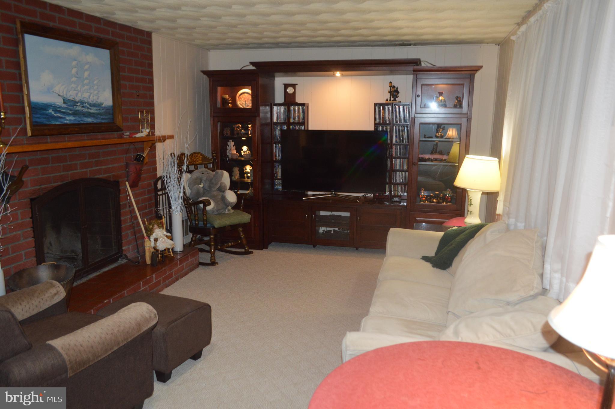 5009 Hagan Road Temple Hills, MD 20748 - Photo 28 of 33 Lower Level Family Room with Fireplace