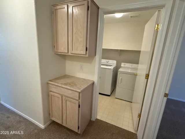 a utility room with a sink a washer and dryer