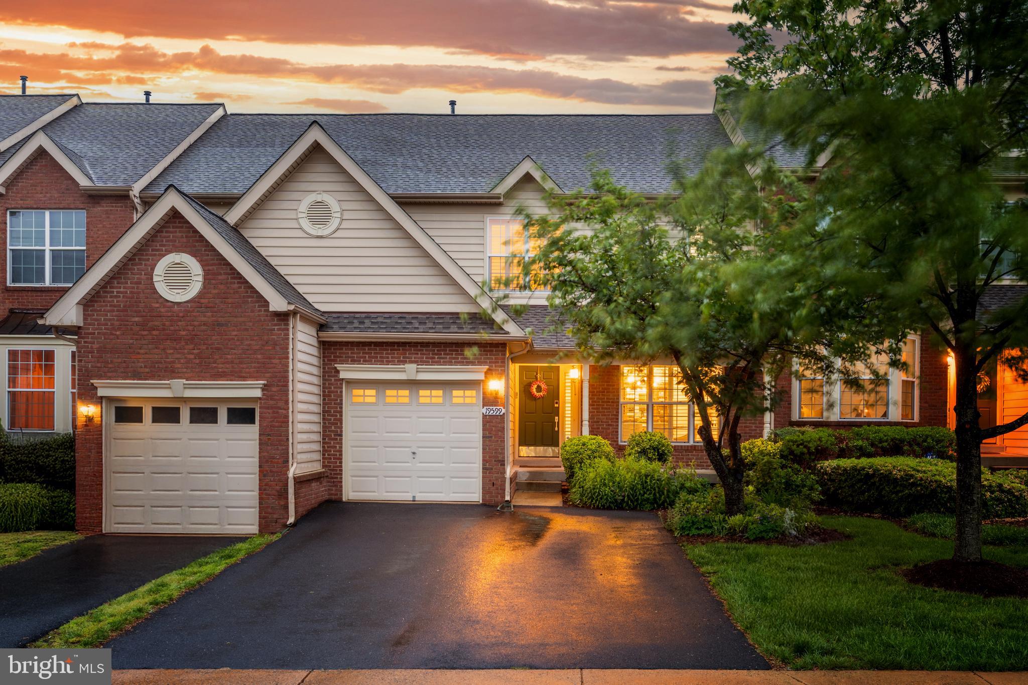 19599 Aspendale Square Ashburn, VA 20147 - Photo 1 of 56 a front view of a house with a yard and garage