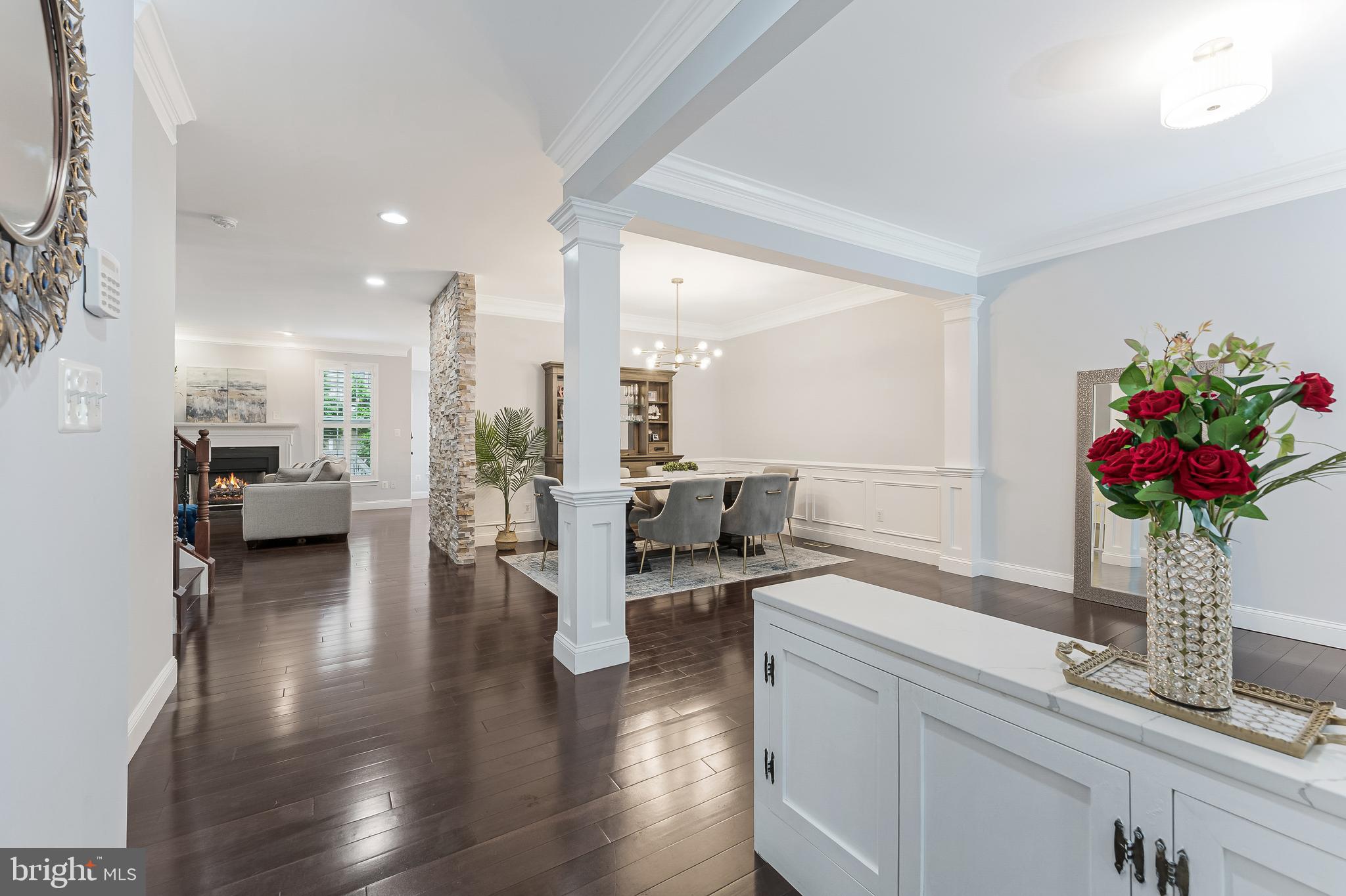 19599 Aspendale Square Ashburn, VA 20147 - Photo 13 of 56 a living room with furniture dining table and a potted plant
