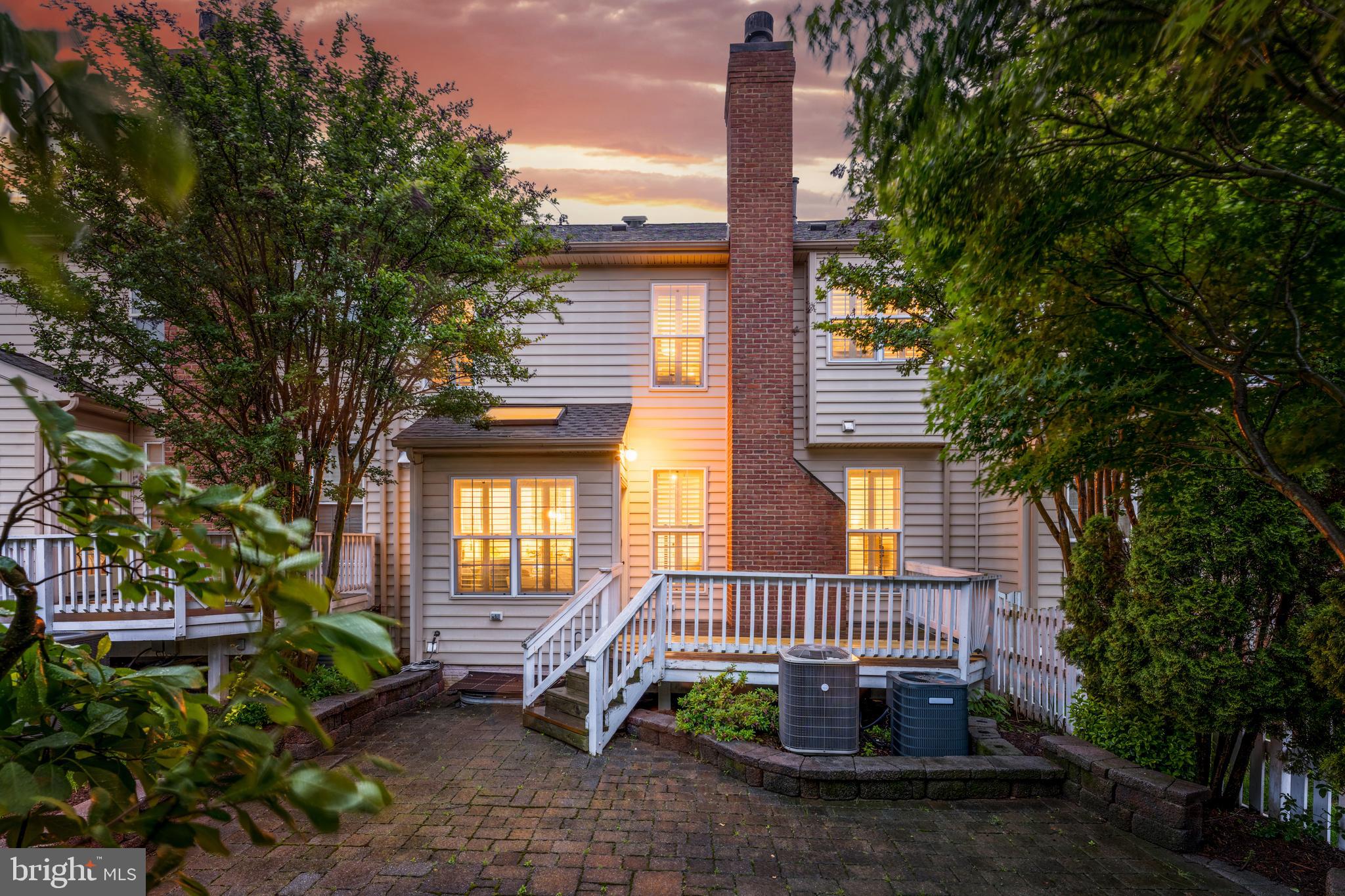 19599 Aspendale Square Ashburn, VA 20147 - Photo 48 of 56 a view of a patio with a table and chairs and potted plants