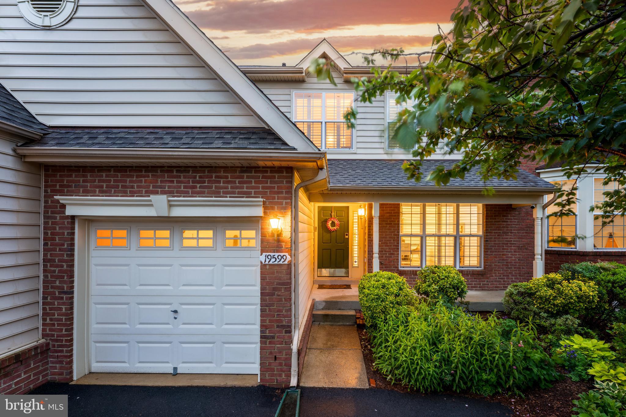 19599 Aspendale Square Ashburn, VA 20147 - Photo 6 of 56 a view of a house with a large window and potted plants